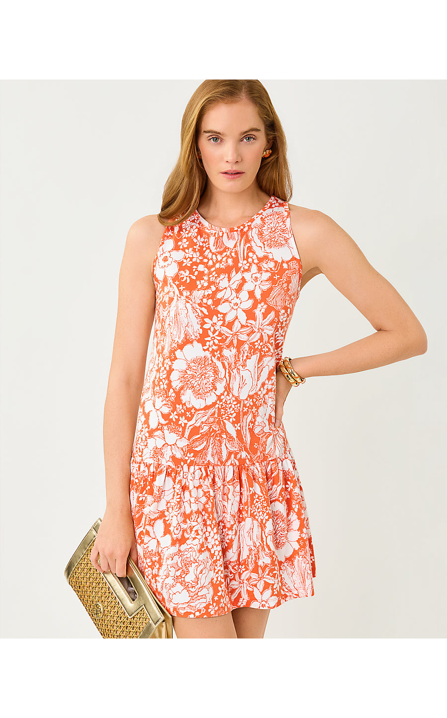 Woman wearing a floral dress with a plain background