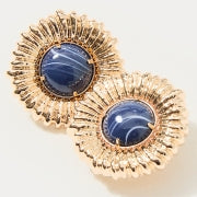 Gold earrings with blue gemstones on a white background